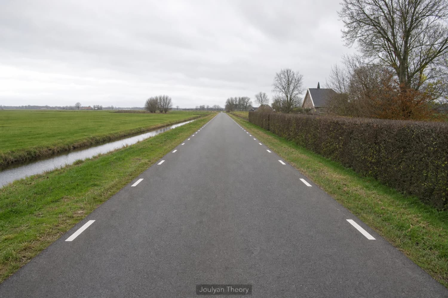 Narrow Dutch rural road without a centre line and with edge markings
