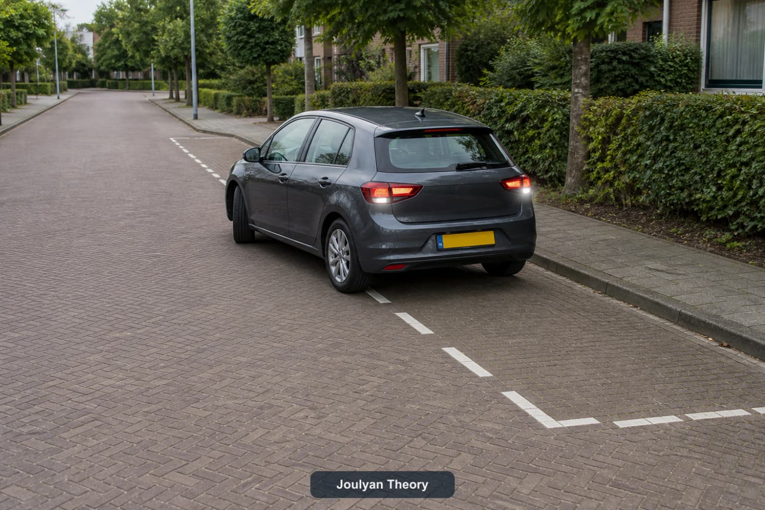 Car reverses into a marked parking bay on a quiet Dutch street