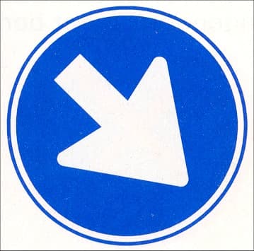 Pass the sign on the side shown by the arrow