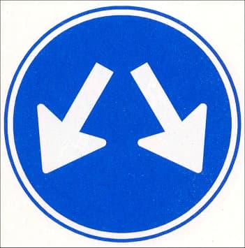 The sign may be passed on either side