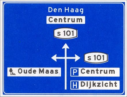 Advance direction sign inside a built-up area